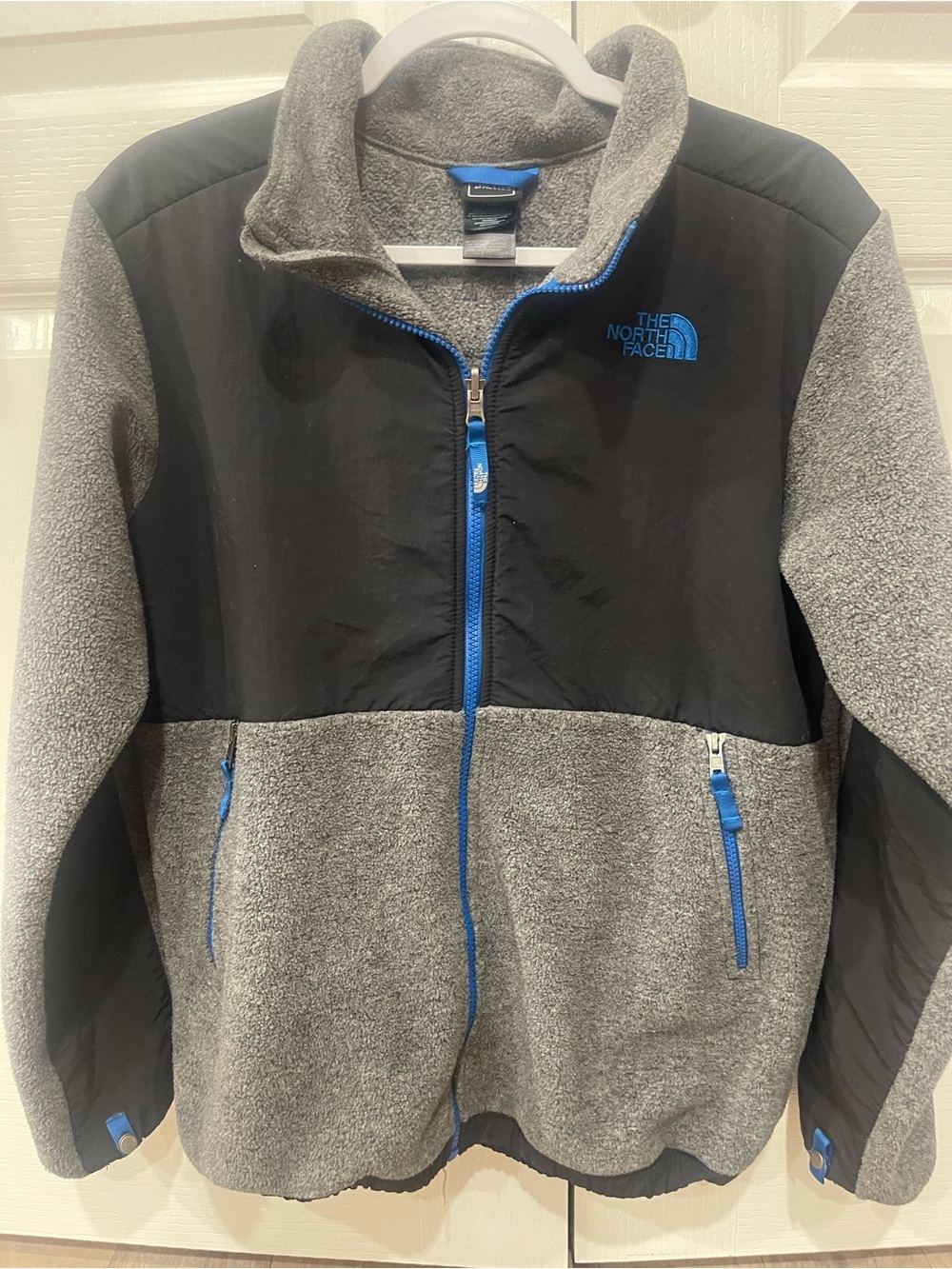 The North Face Grey Fleece Jacket with Black Panels and Blue Accents